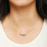 Elegant 14K white gold pendant featuring five round diamonds, IGI certified with D–E color and VVS–VS clarity, finished with a stylish rabbit ear bail.