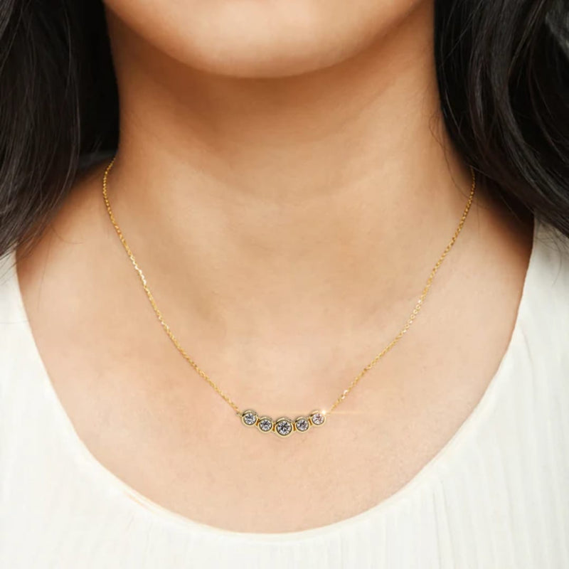 Elegant 14K white gold pendant featuring five round diamonds, IGI certified with D–E color and VVS–VS clarity, finished with a stylish rabbit ear bail.